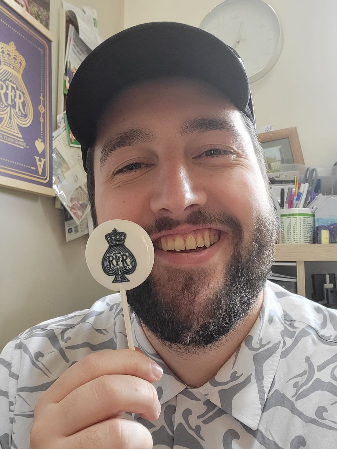 Zac holding a round RFR crest pop
