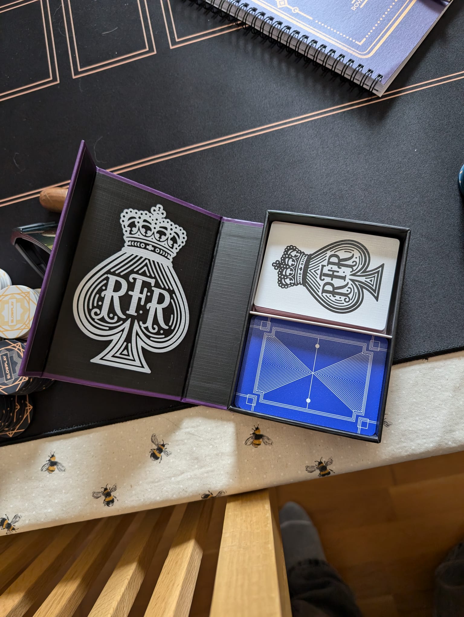 The custom RFR deck holder opened to reveal a blue-backed deck of playing cards