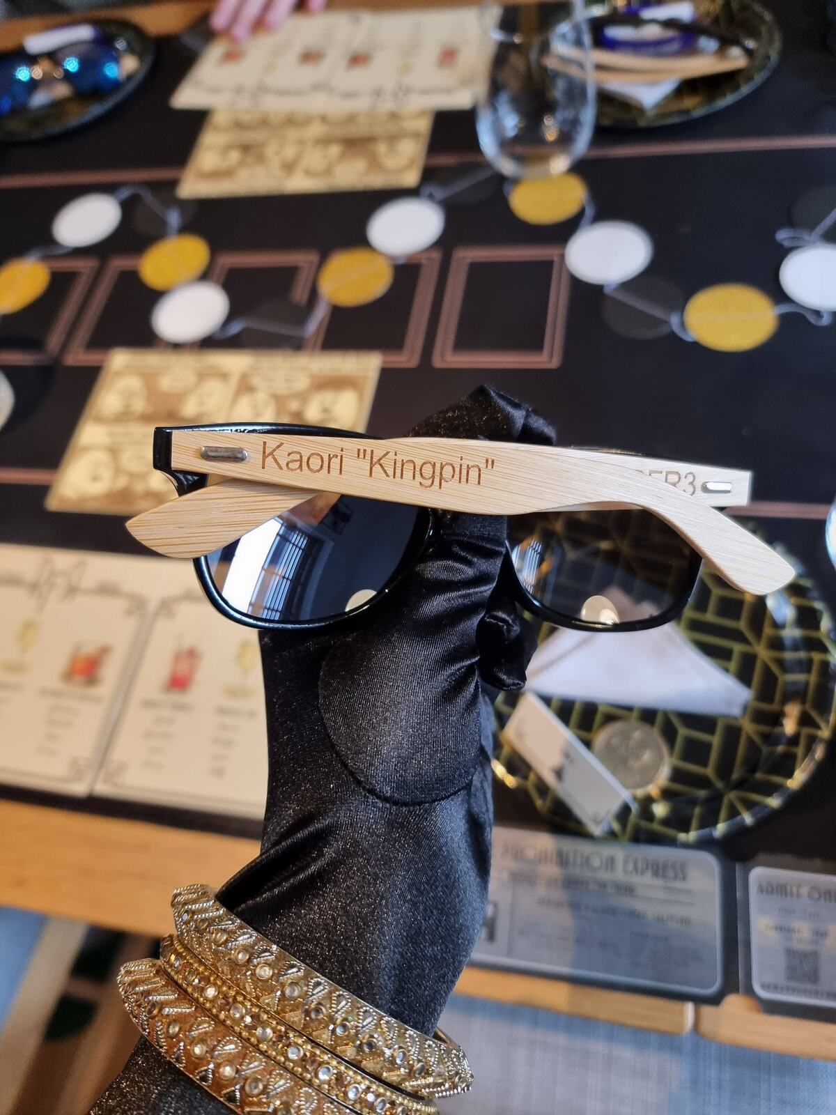 Kaori's personalised RFR III sunglasses marked with her poker nickname, Kingpin