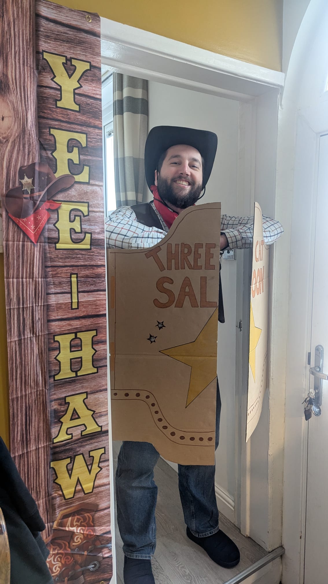 Jamie in Wild West costume standing inside handmade RFR saloon scenery