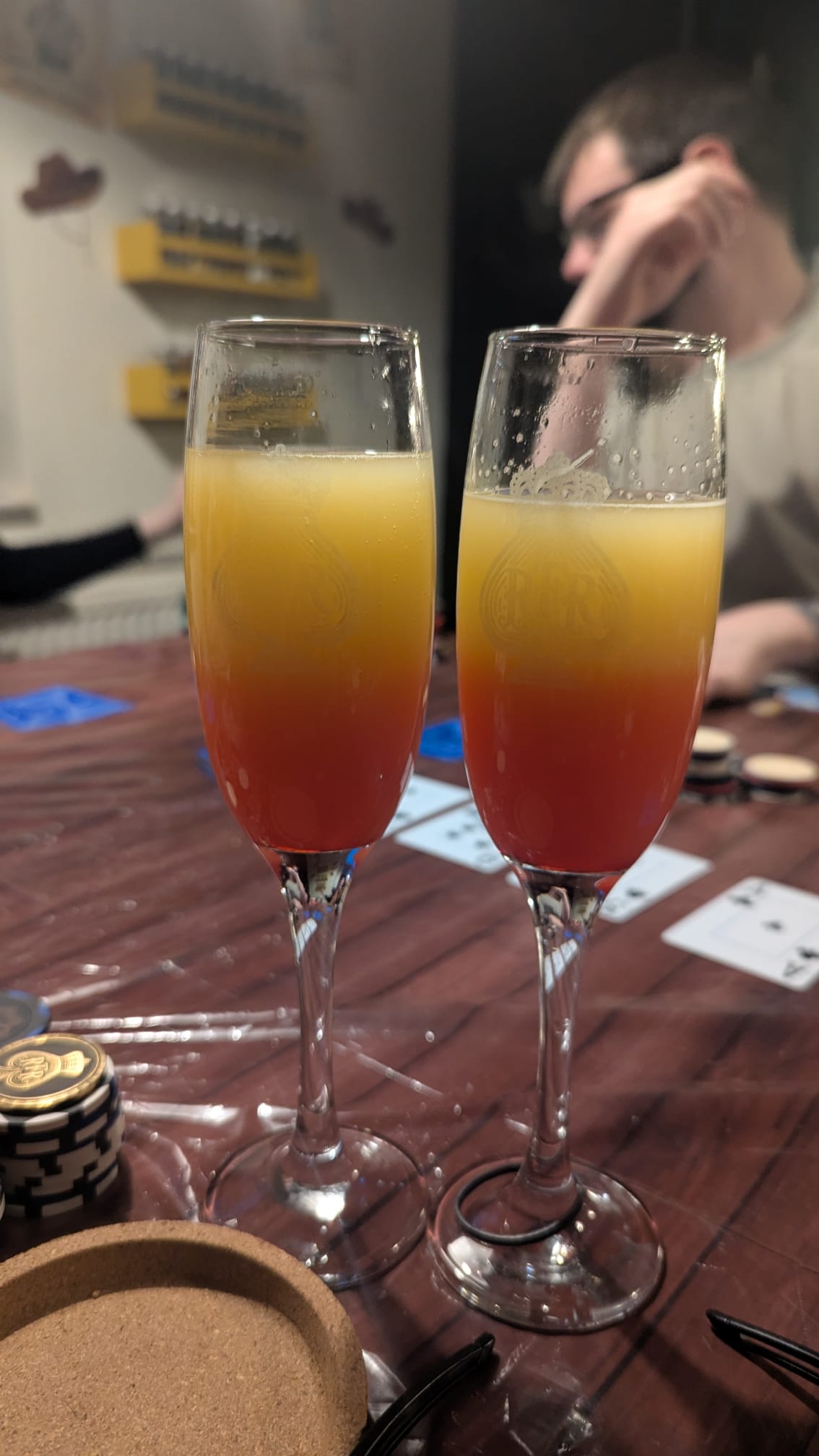 Two orange Wild West drinks in tall glasses