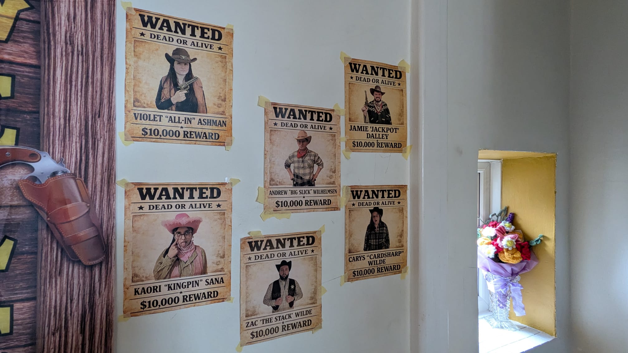 Personalised Wild West wanted posters displayed on a wall